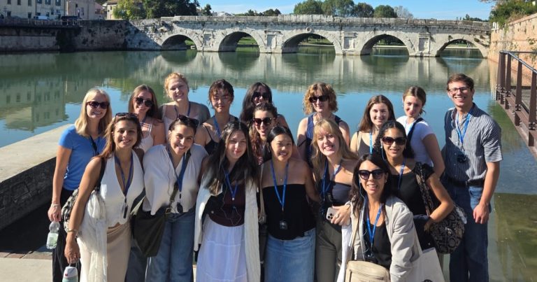 Reggio Emilia, Italy students visit a bridge with five arches.
